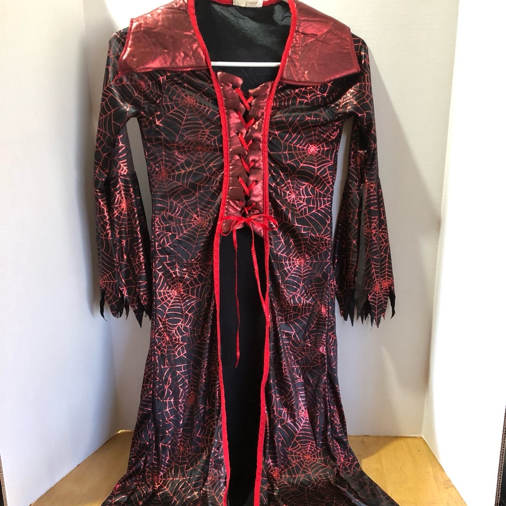 Halloween Witches dress size Small black and shiny red webs throughout.